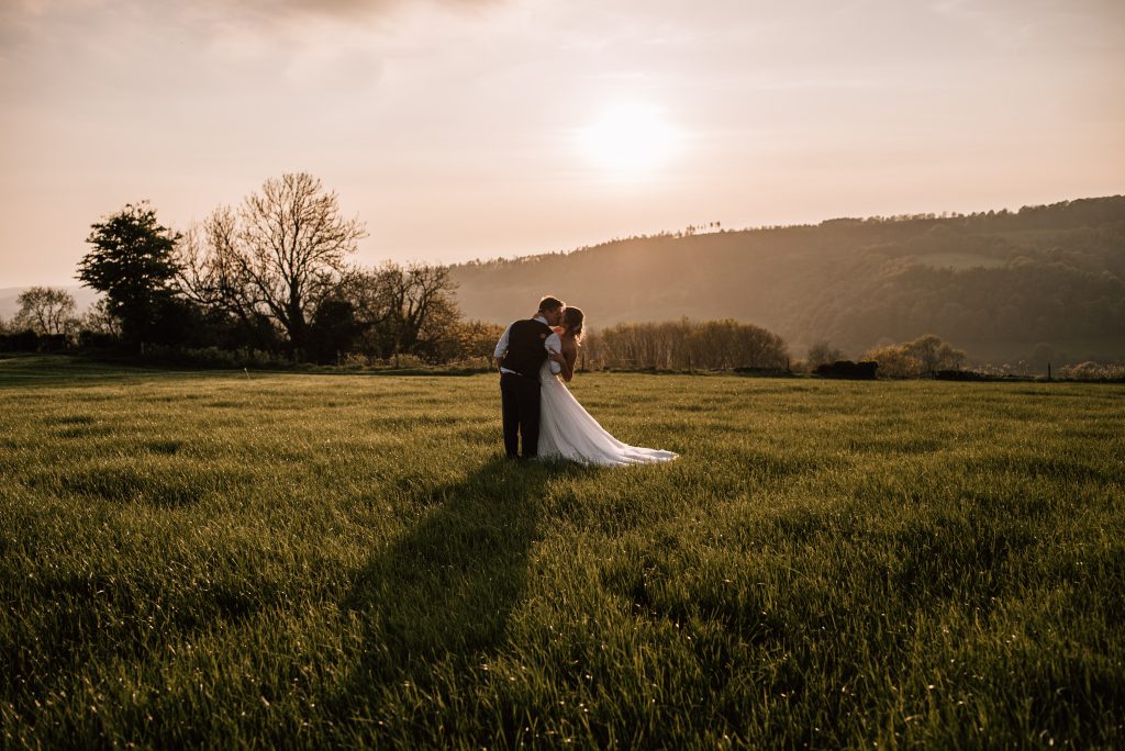 Cotswolds wedding photographer. Sunset photo of bride and groom
