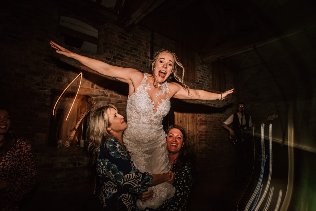 Milton end barn wedding photographer. Bride dancing