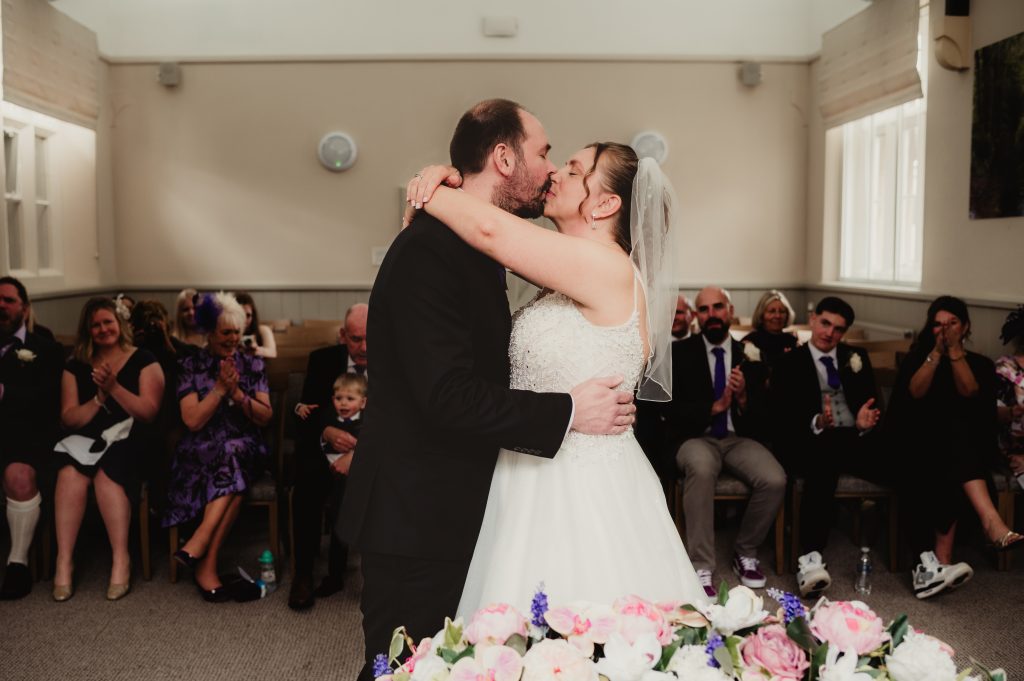 First kiss. candid wedding detail