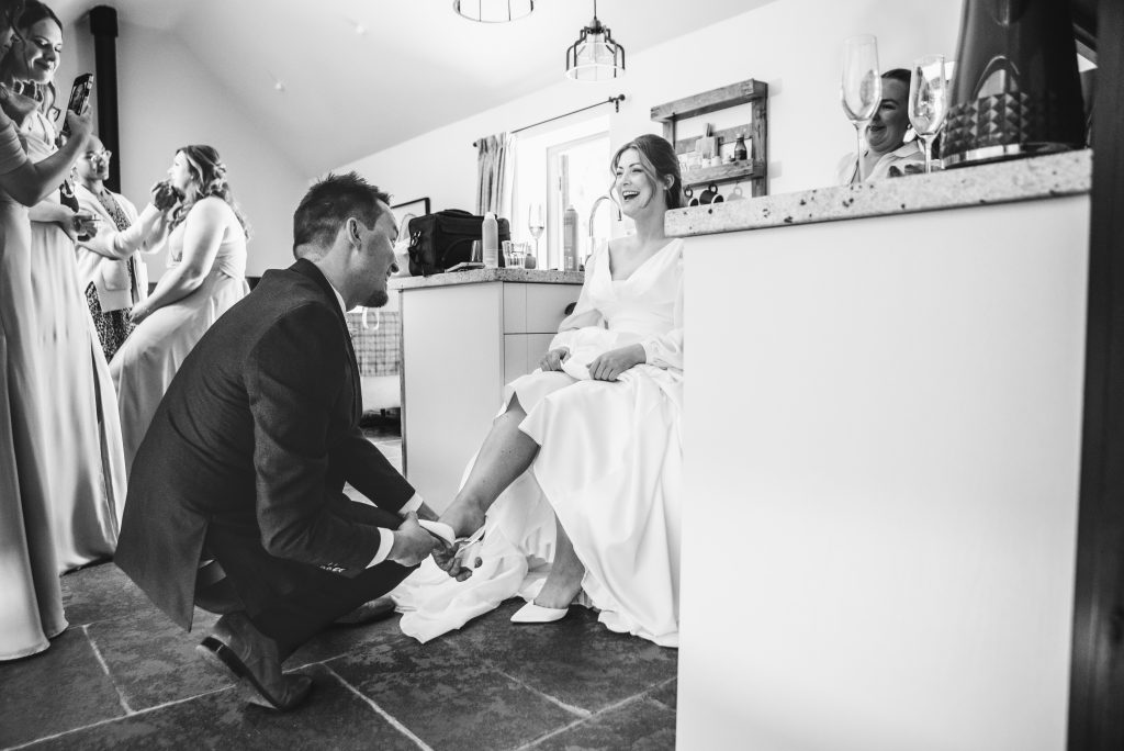 Bride finishing morning preparations at Barns and Yard, Upton upon Severn