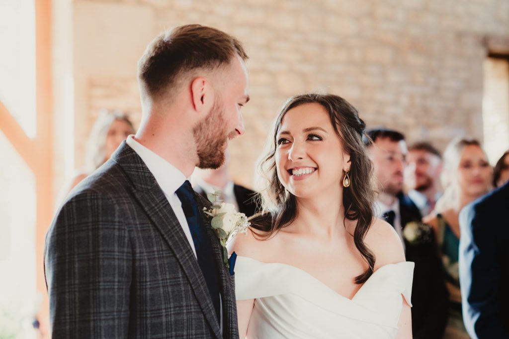 Groom’s emotional reaction during vows, captured by a candid Upcote Barn wedding photographer