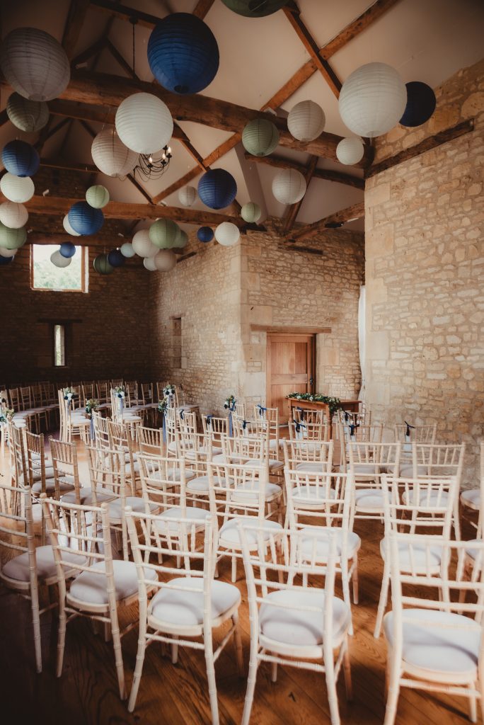 Rustic wedding ceremony setup at The Barn at Upcote, Gloucestershire wedding venue