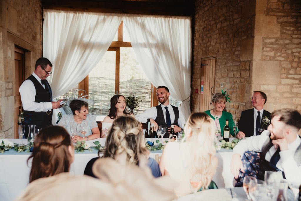 Father of the bride delivering an emotional speech, captured by documentary-style Gloucestershire wedding photographer